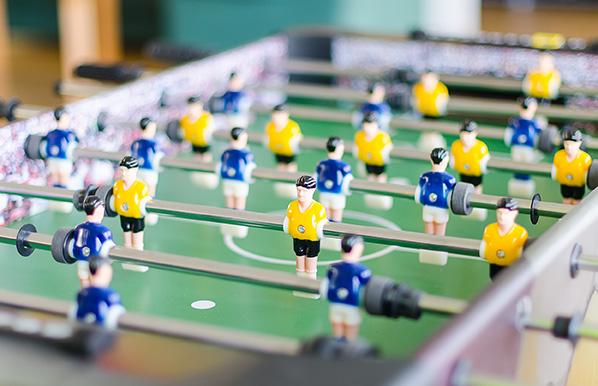 A foosball table, ready to be played.