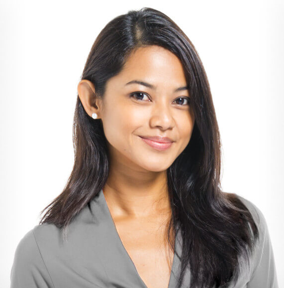 An Asian woman smiling.